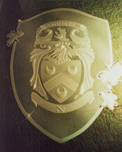 deep carved family crest for restaurant
